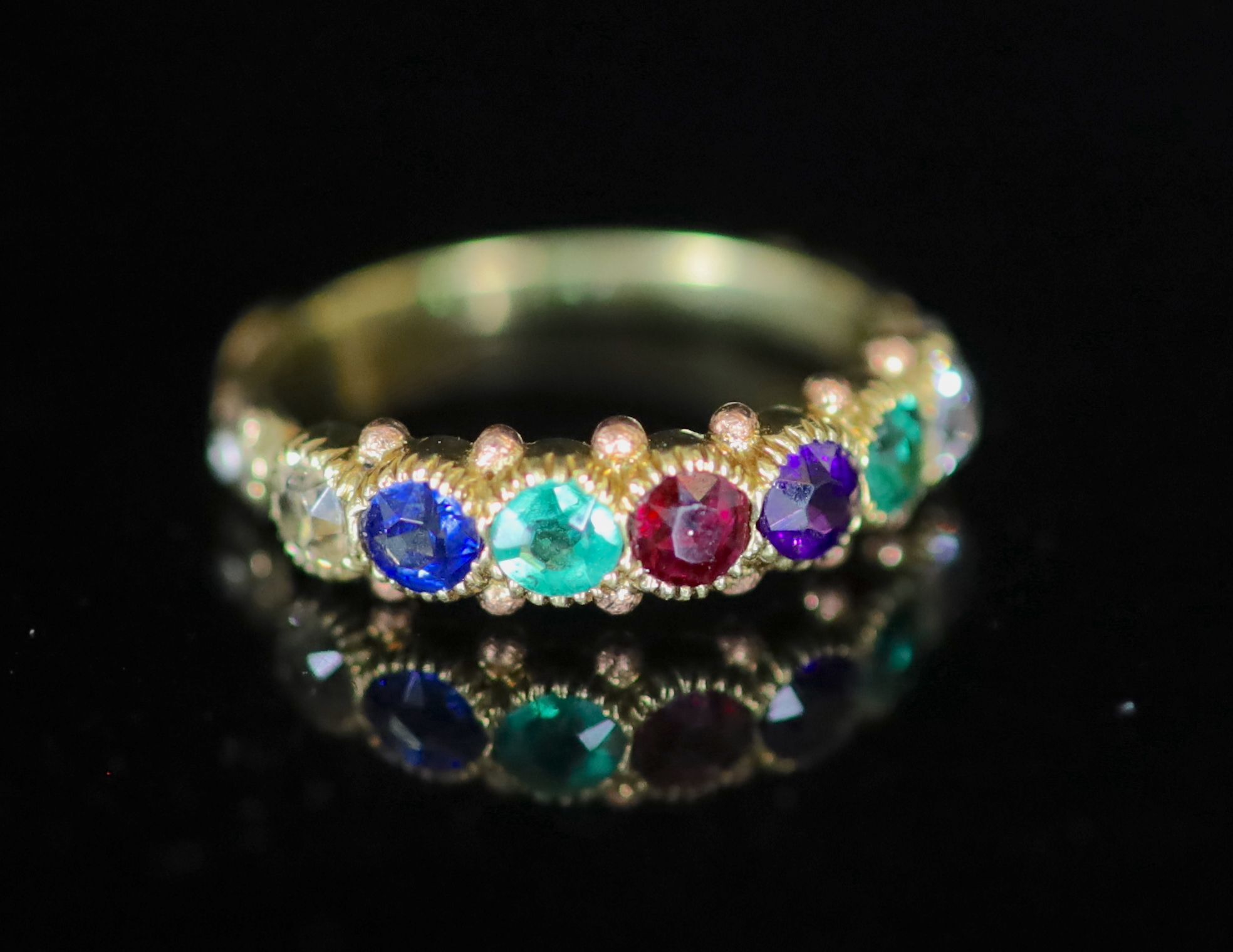 A 19th century gold and multi gem set ‘Dearest’ half hoop ring